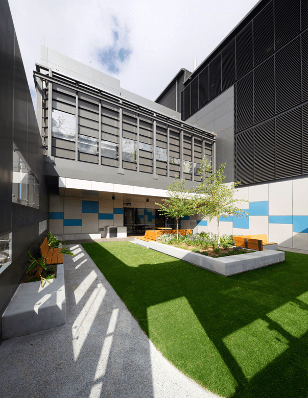 Two story commercial building in the heart of Sydney with external aluminium louvres.
